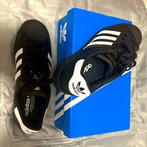 Adidas Superstar black and white sneakers, US 9 for men/10 for women, new